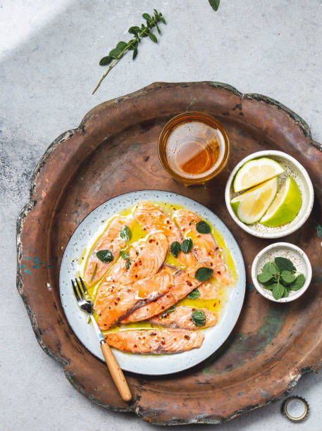 istock Salmon carpaccio. Salmon marinated in lemon. Top view 1332336943