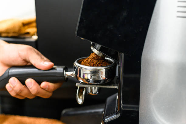 Freshly roasted coffee grinder to turn the beans into powder. Freshly roasted coffee grinder to turn the beans into powder coffee grinder stock pictures, royalty-free photos & images