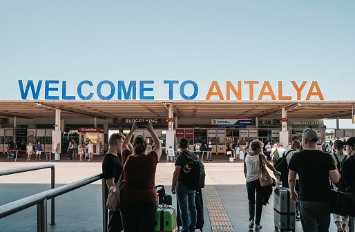 Antalya, Turkey - 4 August 2021: Vacationers and tourists arrive in Antalya resorts. Rest and travel in Turkey. High quality photo
