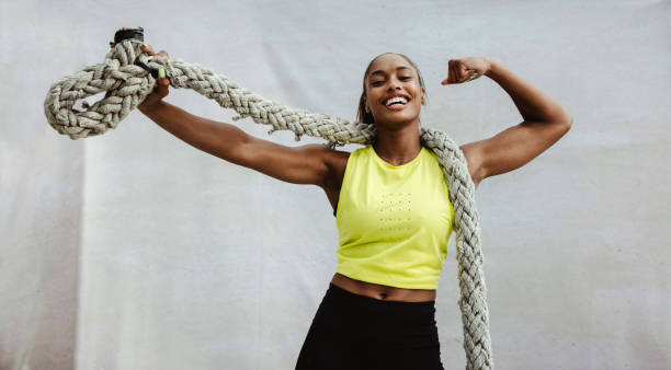 istock Fitness woman flexing biceps after cross training 1332338210