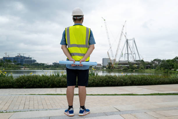 istock Backside portrait of male engineer at construction site 1332339437