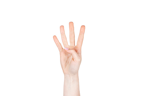 Hand with four fingers raised on white background isolated. Concept hands and body part