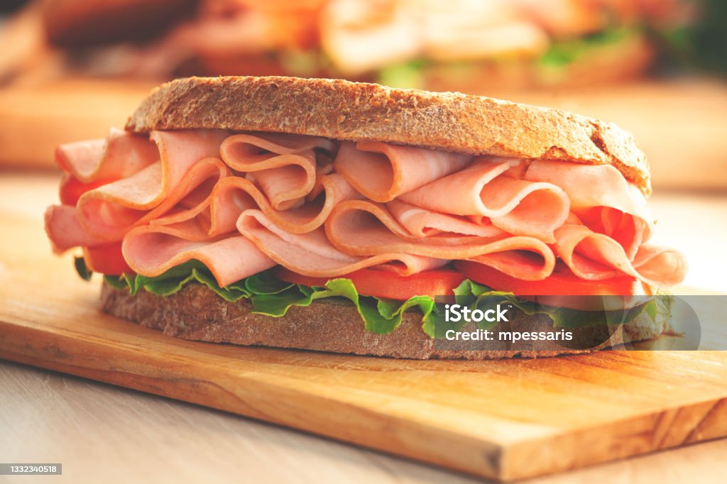 Sandwich with smoked ham and fresh lettuce Sandwich Stock Photo