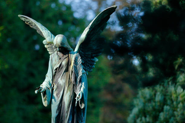 istock Antique Angel statue in a Cemetery 1332342329