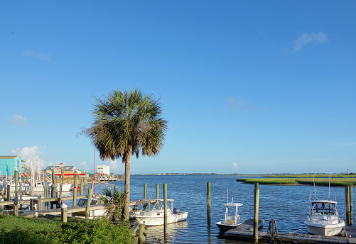 View of Southport NC riverfront with boat docks and seafood restaurants