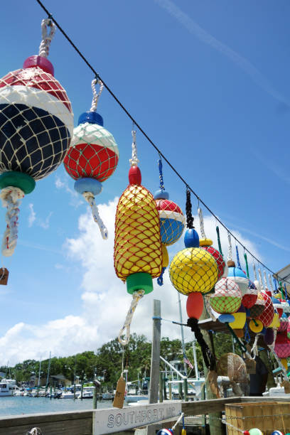 colorful buoys hanging on a dock in southport north carolina - cape fear imagens e fotografias de stock