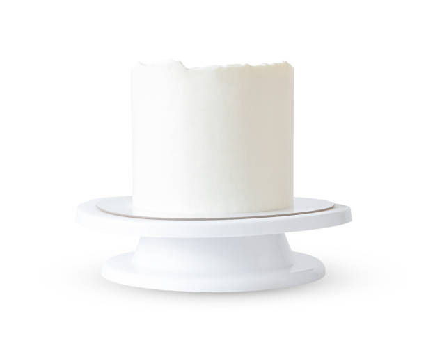high white cake without decor on a stand isolated on white background. even round cake mockup and sample