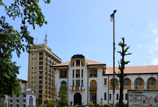 Freetown, Sierra Leone: Supreme Court of Sierra Leone, has final jurisdiction in all civil, criminal, and constitutional cases within Sierra Leone, and its decisions cannot be appealed - old British colonial Law Courts, the buildings foundation stone of this building was laid by Prince Arthur, Duke of Connaught in 1910 - Sierra Leone Commercial Bank (SLCB) tower on the left, billboard promoting elections on the right - Central business district.