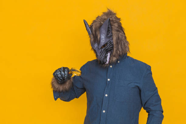 istock A werewolf looking through a magnifying glass 1332350044