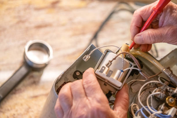 Home Artisans - Repairing Coffee Machine in the Kitchen - DIY stock photo