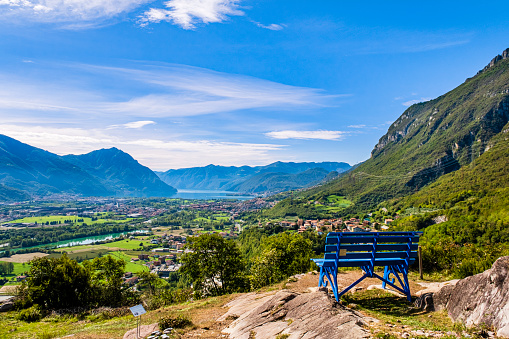 Big blue bench installed in Rogno, in a very panoramic position overlooking Lake Iseo and the final part of Valle Camonica.