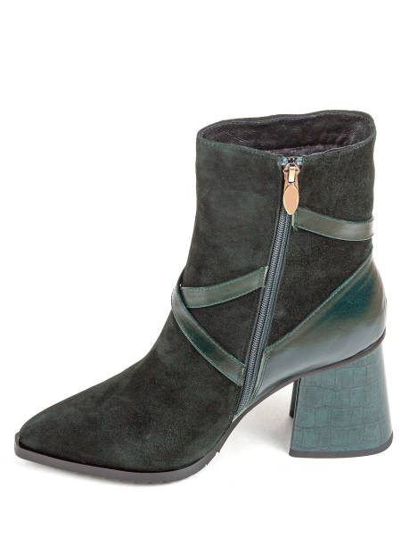 istock Green women's autumn boots on middle heels isolated on white background 1332355129
