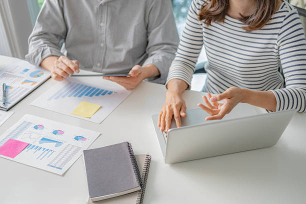 istock Professional investor working with new startup project. Digital tablet laptop computer design smart phone in office. 1332357197