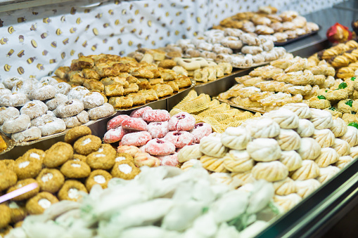 Homemade Moroccan pastries displayed in a traditional food market.