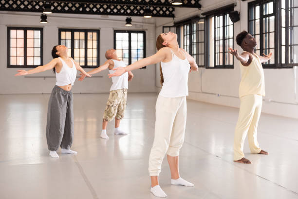 istock Group of people performing relaxing dance 1332358573