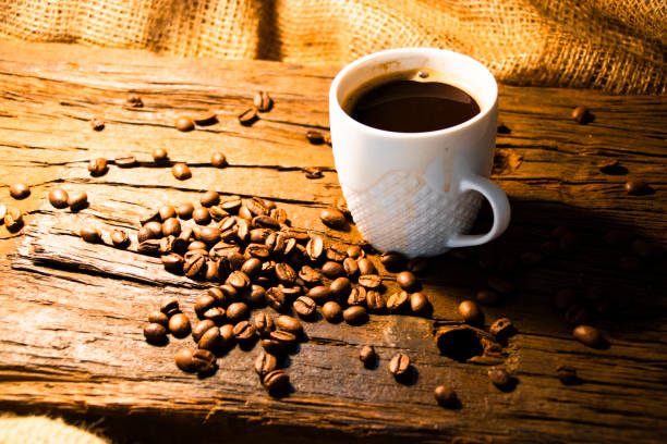 istock Coffee with beans on wood 1332361931