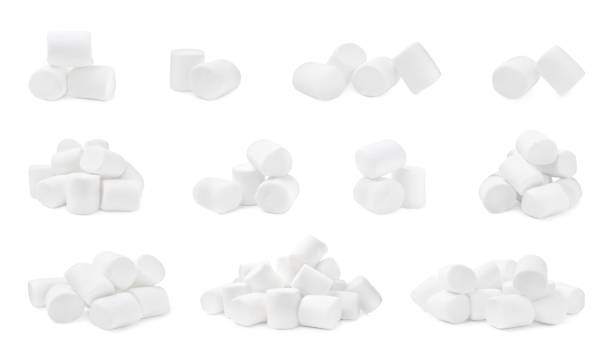 Set with delicious sweet puffy marshmallows on white background