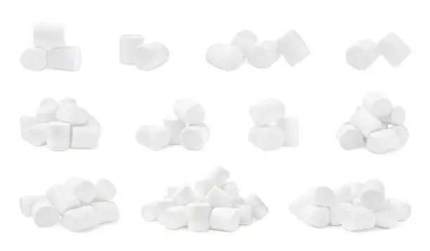Photo of Set with delicious sweet puffy marshmallows on white background