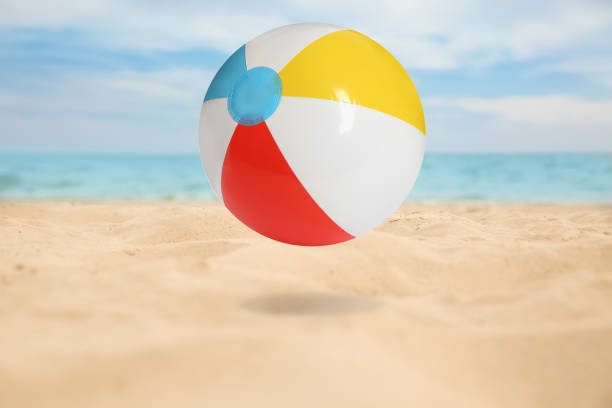 istock Colorful inflatable beach ball and seascape on background 1332364670
