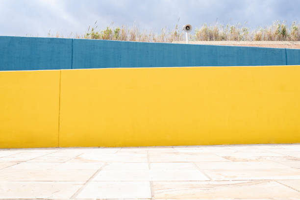 istock nice yellow and blue wall, and the sky 1332366332