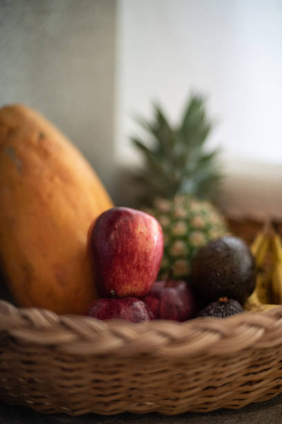 istock Basquet with a tropical fruits 1332367436