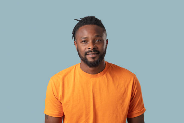 istock headshot of a handsome man on blue background 1332369176