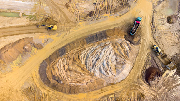 istock Gravel and sand open pit mining, sand hills - aerial view 1332369338