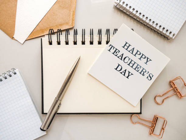 istock Happy Teacher's Day. Notepad with a congratulatory inscription 1332371236