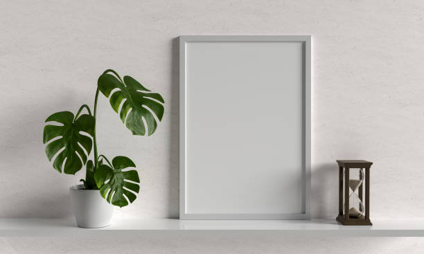 istock MONSTERA plant in vase with white frame mockup, 3D rendering 1332371482