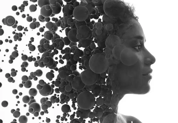 Black and white portrait of a woman combined with a flow of particles
