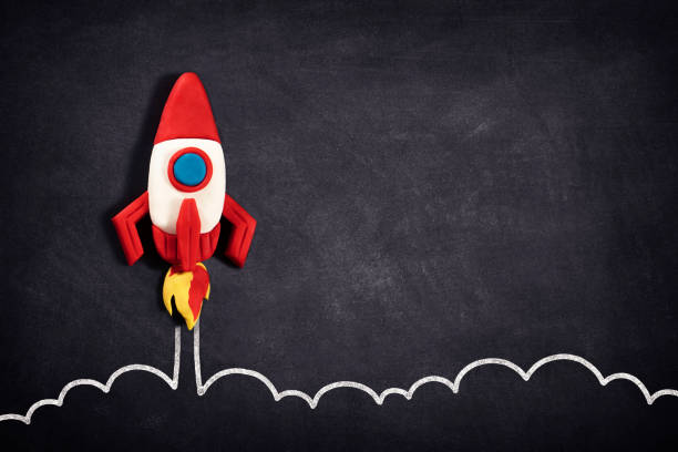 istock Business Startup Concept with Spaceship on Blackboard 1332372897