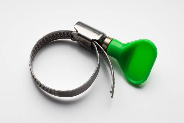 Metal hose clamp with green plastic handle on white background