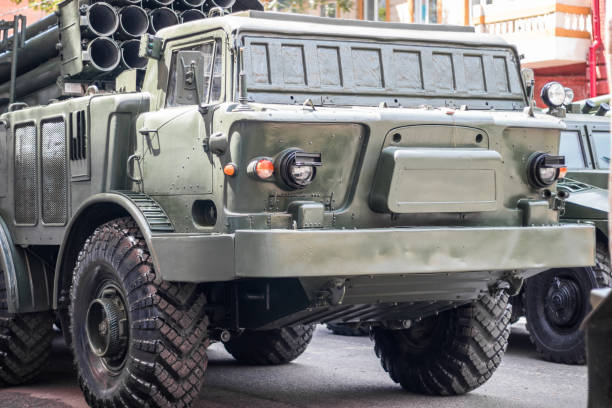 istock Military artillery , self-propelled multiple rocket launcher system on a city street 1332373759