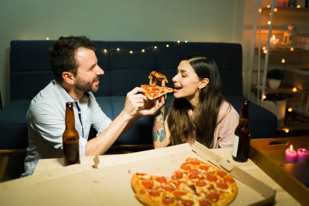 istock Happy couple having dinner at home after work 1332376180