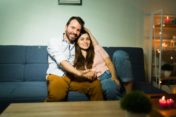 istock Couple in love smiling and looking at the camera 1332376352
