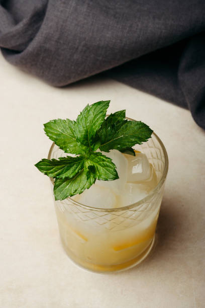 istock Lemonade with ice and mint in the glass 1332377420