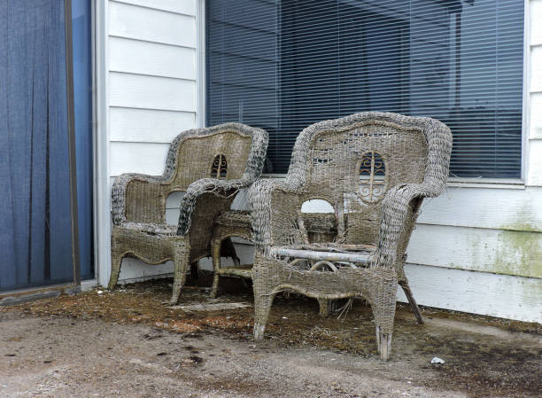 istock Abandoned Wicker Chairs On Porch 1332377641