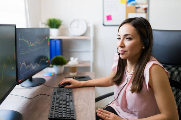 istock Stock broker making a work call at home 1332378411