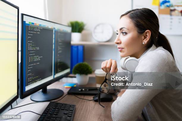 A Pretty Computer Programmer Beautiful Programmer Checking Her Code Stock Photo - Download Image Now ...