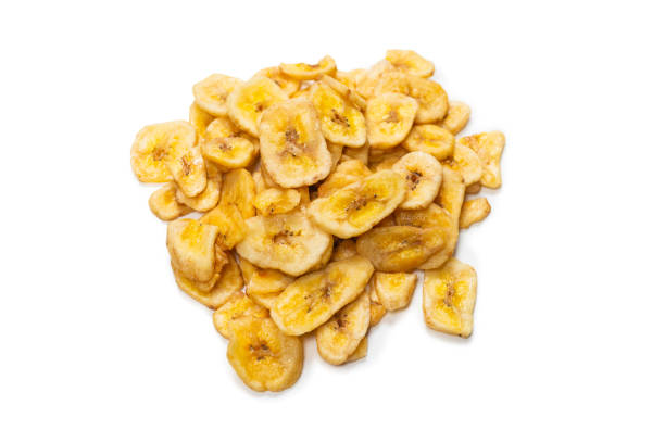 istock Banana chips isolated on a white background. Dehydrated banana. 1332378728
