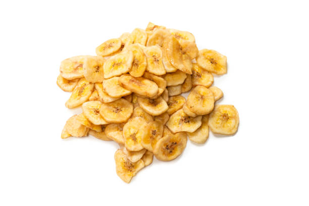 istock Banana chips isolated on a white background. Dehydrated banana. 1332378729