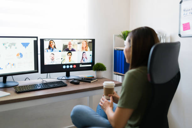 istock Latin manager taking with her co-workers online 1332378910