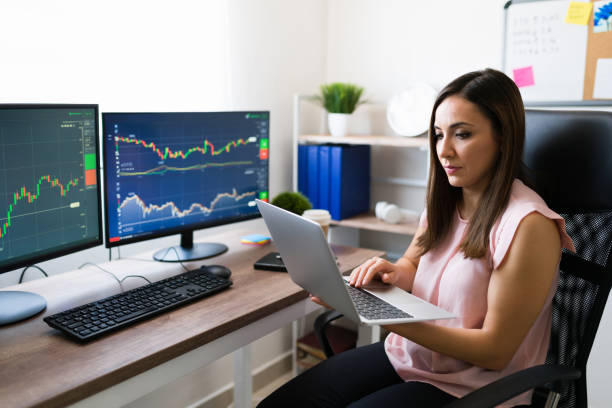 istock Young woman in the trading business multitasking 1332379705