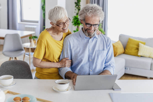 istock A mature couple using a laptop at home and planning home finances 1332379833