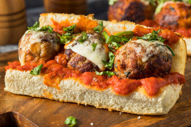 Homemade Cheesy Meatball Sub Sandwich Homemade Cheesy Meatball Sub Sandwich with Marinara and Provolone meatball stock pictures, royalty-free photos & images