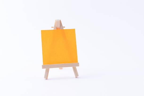 istock Wooden Easel Miniature with Blank Colored Square Canvas or Memo Paper 1332381746