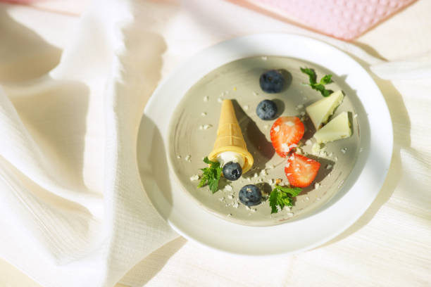 Cream dessert with berries on White background.