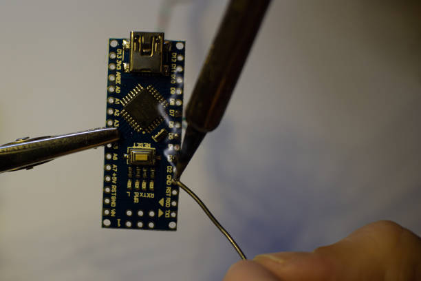 istock The process of soldering wires to an open-source hardware and software nano. 1332384345