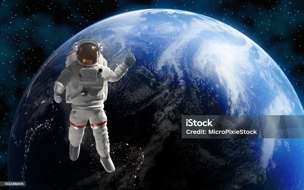 Astronaut or Cosmonaut in Outer Space for Exploration with Planet Earth at Background Astronaut or cosmonaut is in outer space for exploration with Planet Earth at background. Map image is courtesy of NASA: https://visibleearth.nasa.gov/images/57723/the-blue-marble. Easy to crop for all your social media and design need with copy space. Astronaut Stock Photo