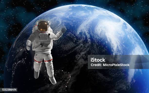 Astronaut Or Cosmonaut In Outer Space For Exploration With Planet Earth At Background Stock Photo - Download Image Now